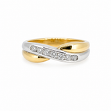 Beautiful two-tone yellow and white gold crossover ring with 7 sparkling natural diamonds.