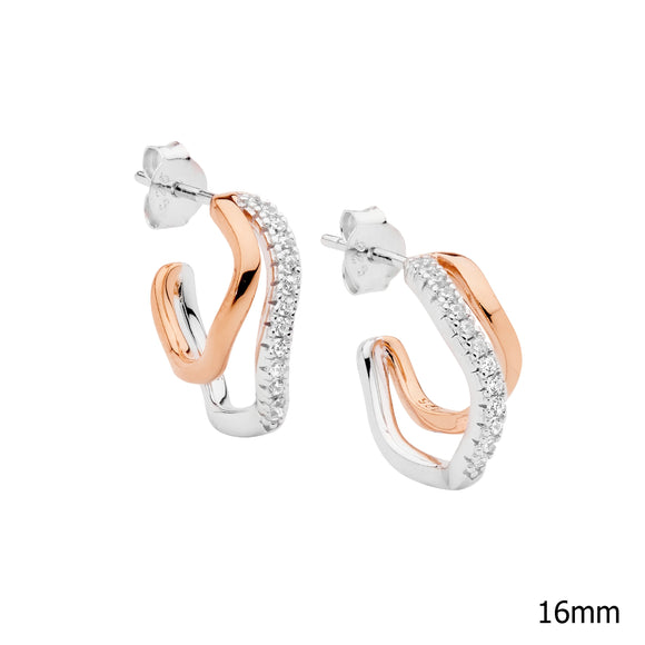 A pair of two-tone rose gold and silver hoop earrings with cubic zirconia embellishments,