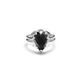 A sterling silver ring with a large natural onyx stone set in a wide band, with a claw-like design.