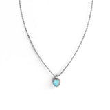 The signature Love Claw Necklace by Stolen Girlfriends Club features a heart-shaped faceted Bello Opal suspended in a claw setting, crafted in sterling silver.