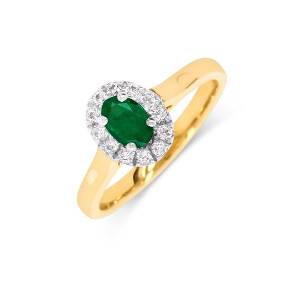 A 9ct gold diamond and emerald cluster ring with a white gold claw setting and a yellow gold band.